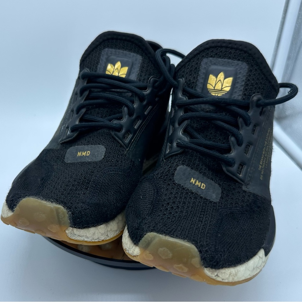 NMD adidas 4Y kids, black and gold.